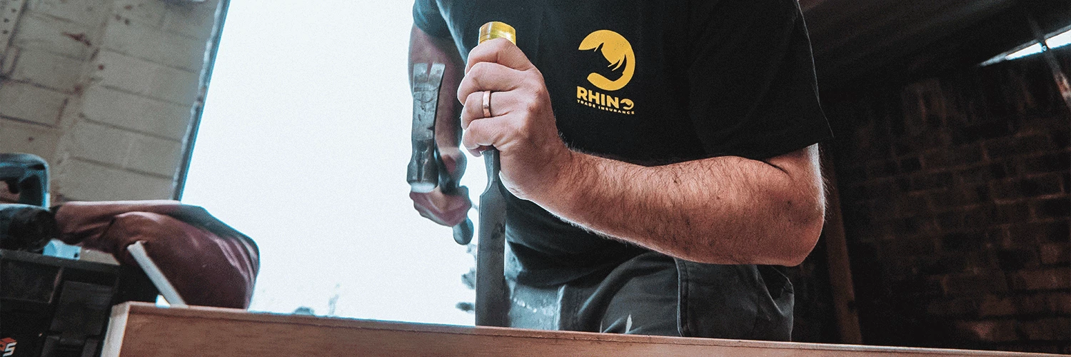 carpenter using a chisel