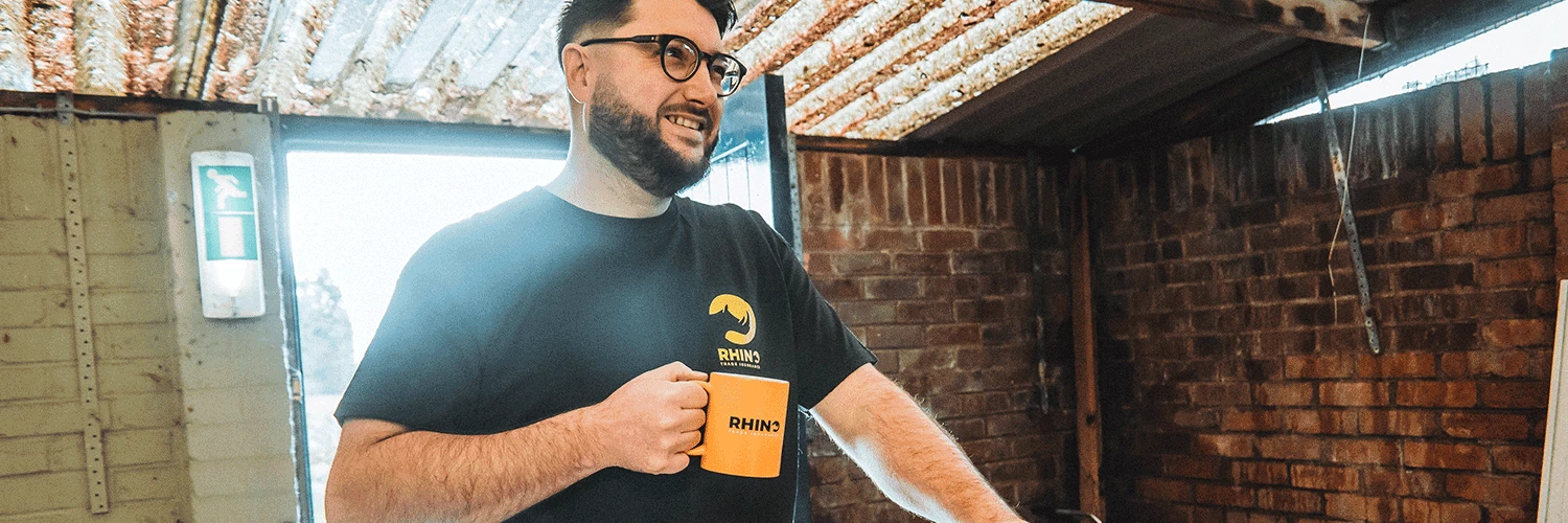 carpenter with a rhino mug on site