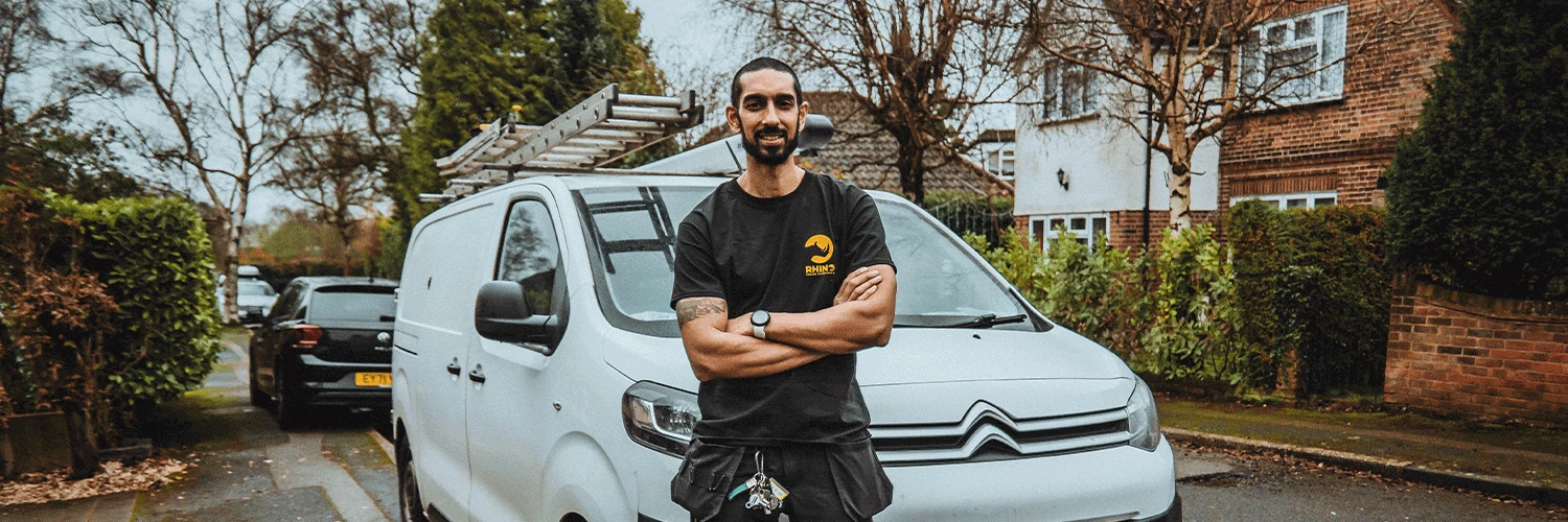 gas fitter in front of van